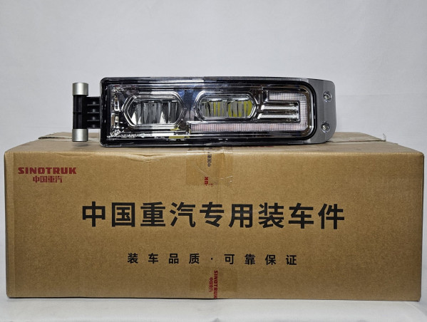 Фара противотуманная левая HOWO 811W25320-6003 Sinotruk — 2